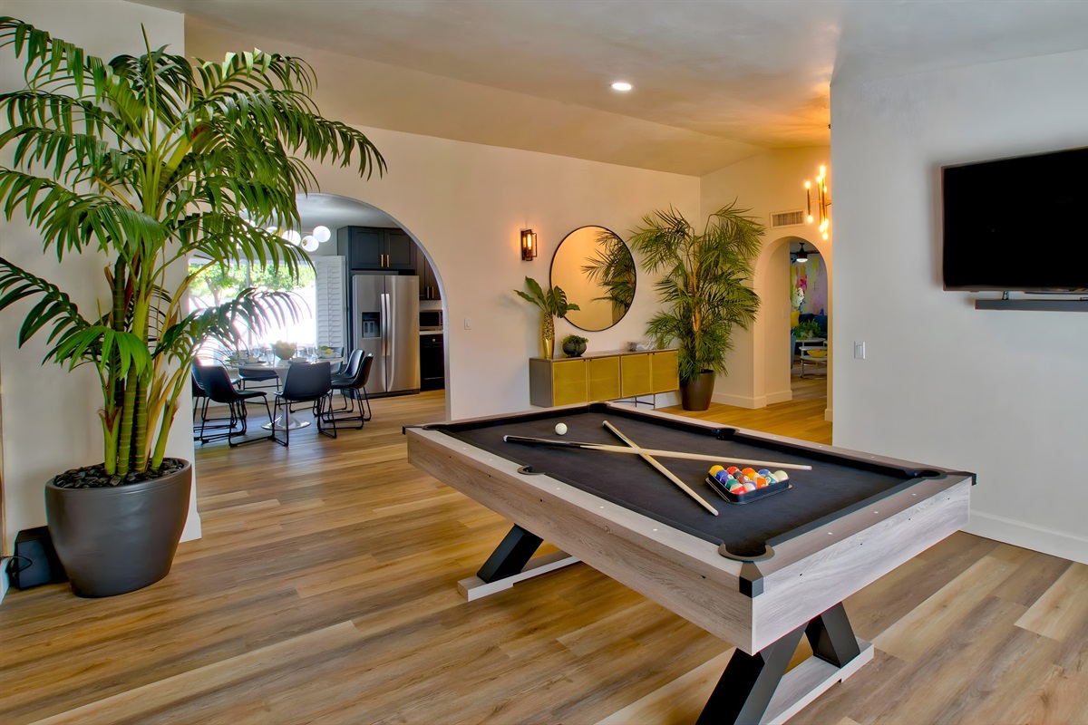 Front room with pool table and TV