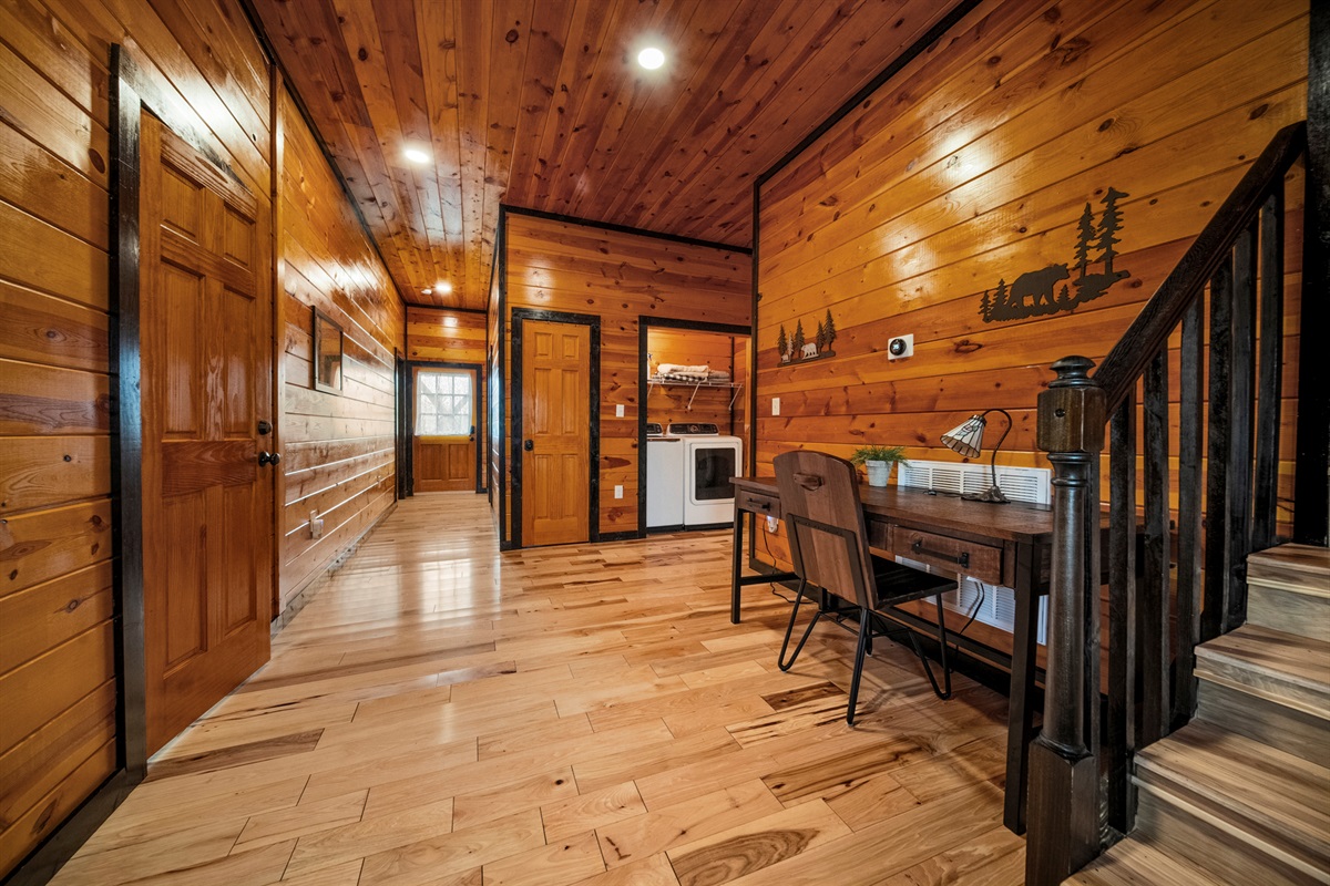 When you enter the foyer, there will be a dedicated work space to your right, the 2 doors on the left are the bedrooms, the W/D are on the right, the largest bath is on your right and the back door is at the end of the hallway.