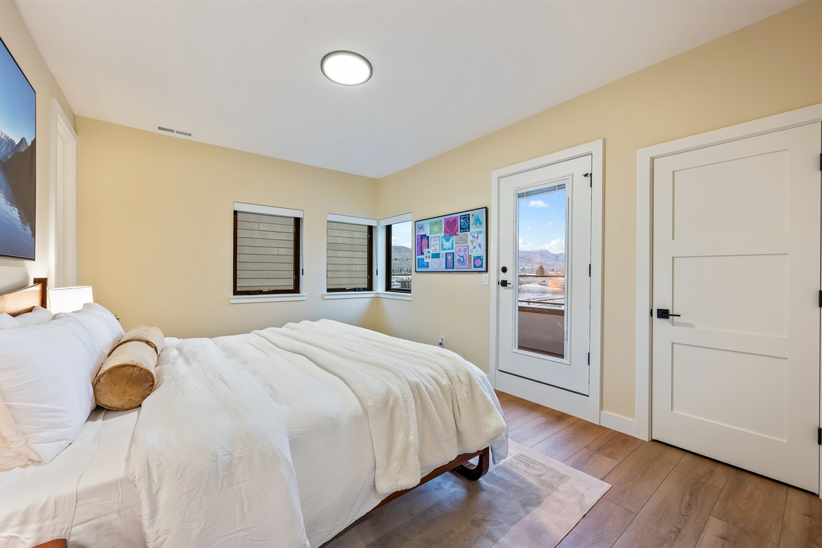 Bedroom #5 of 7 - Upstairs, king bed, Smart TV, ensuite with walk in shower, access to private balcony for catching the sunrise