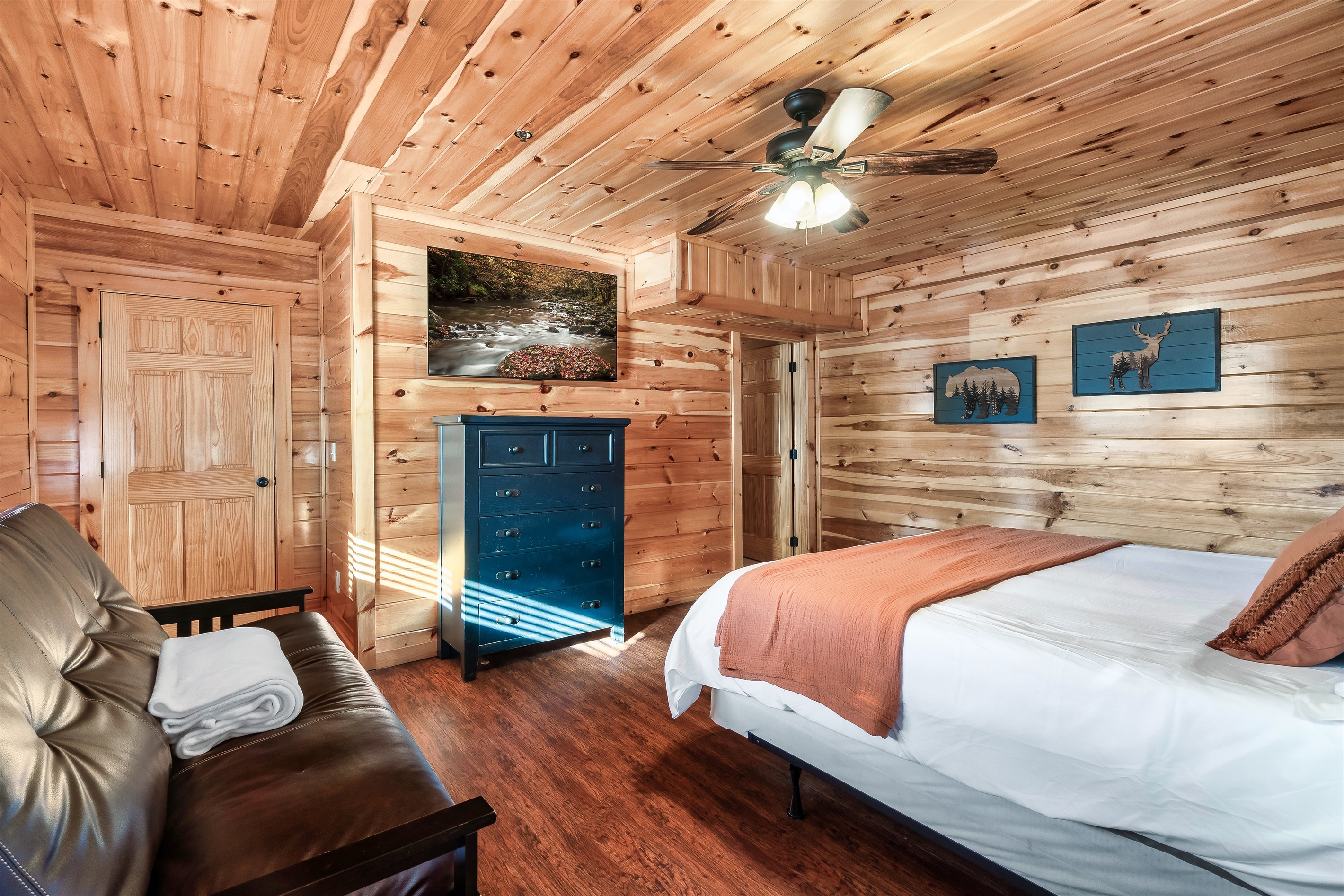 Stretch out in this welcoming queen bedroom with soft linens, a Smart TV, and extra space to unwind.