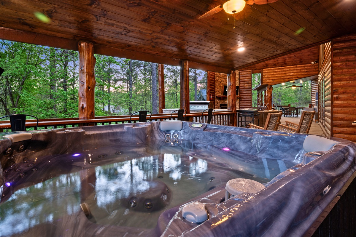 Sink into the bubbling hot tub on the covered deck and take in the surrounding trees, creating a quiet spot to unwind any time of day.