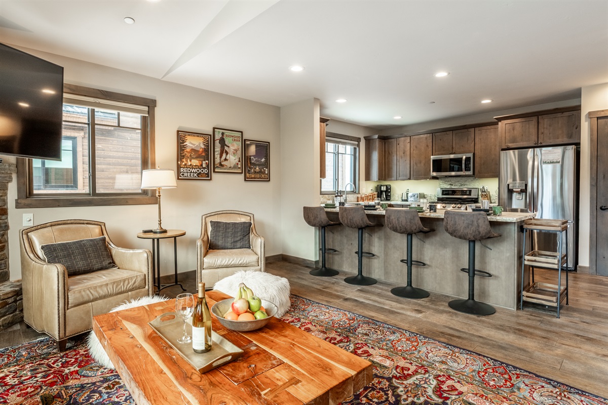 Open sightlines connect lounge, dining, and kitchen—designed for gathering without crowding.