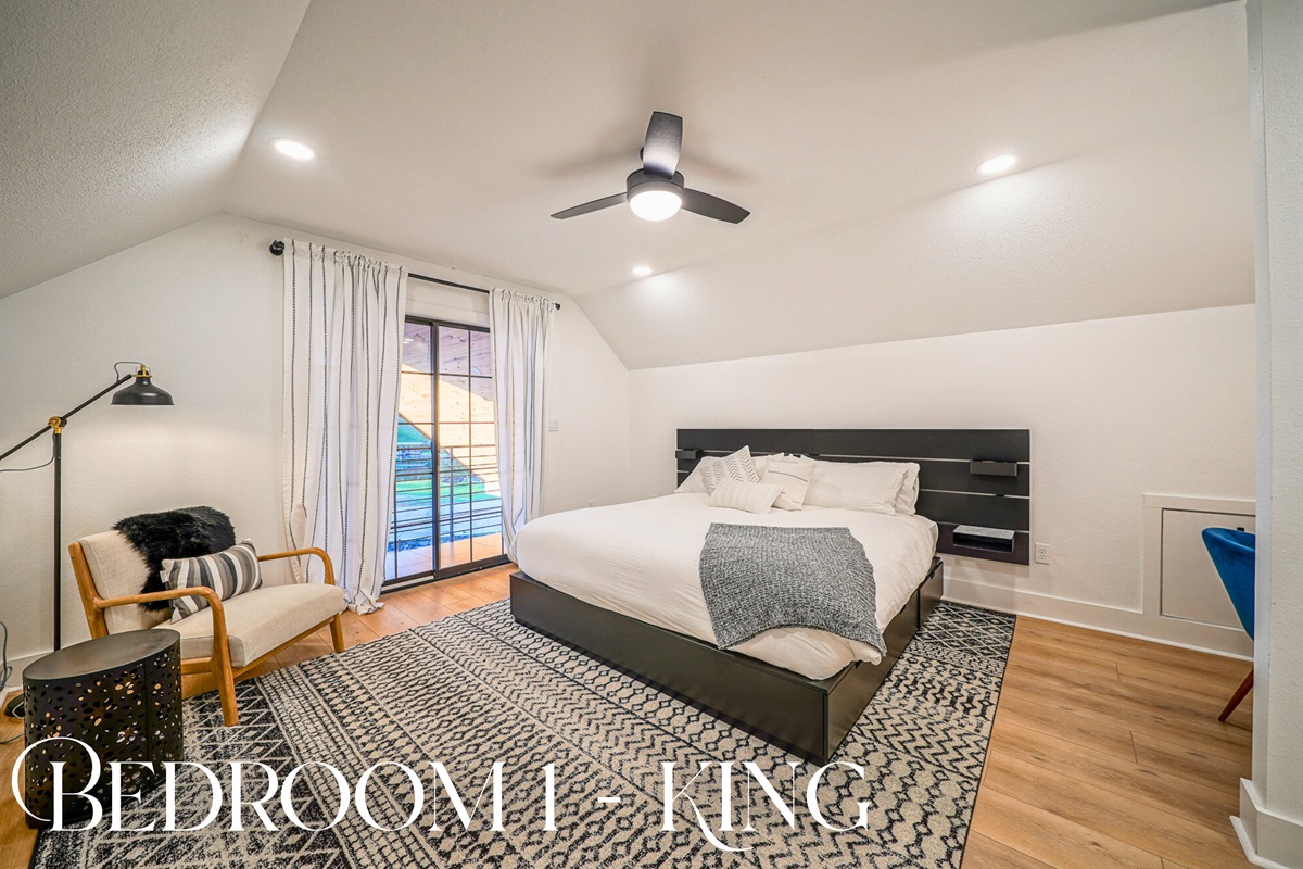 Sleep in style in this serene king suite with soft linens, natural light, and direct patio access — your lakeside retreat awaits.