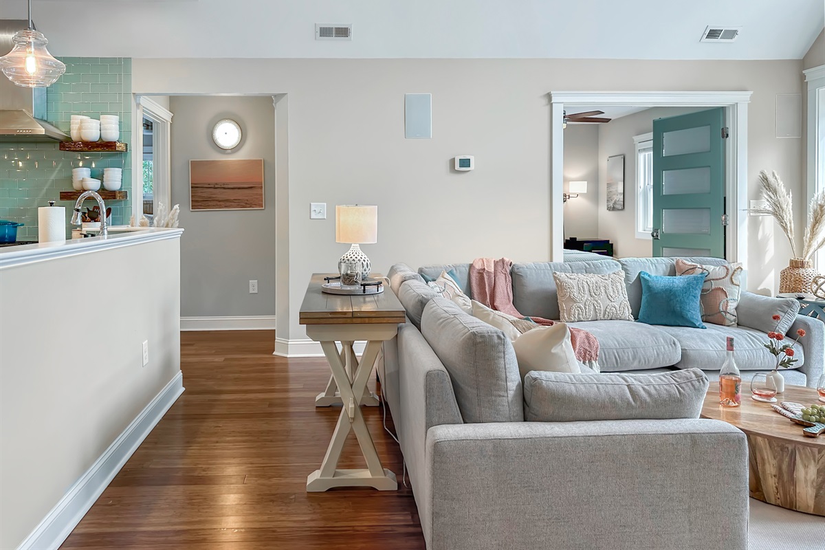 The Living Room joins seamlessly with the Kitchen. (King and Queen bedrooms are in the background).