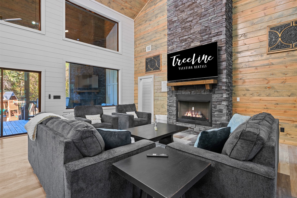 Curl up on the sofa and enjoy movie nights by the glowing fireplace in the heart of the cabin.