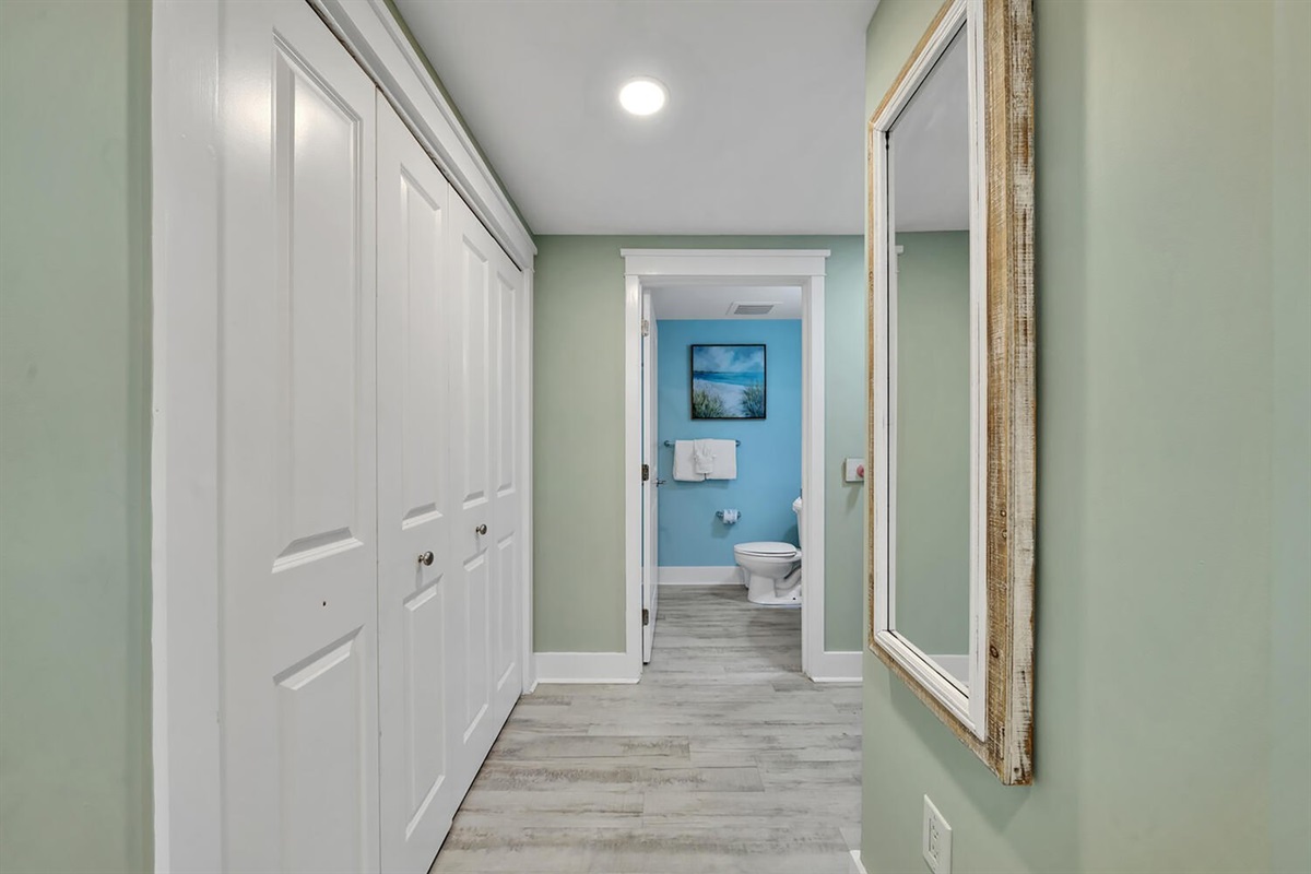 Hallway leading to second bathroom