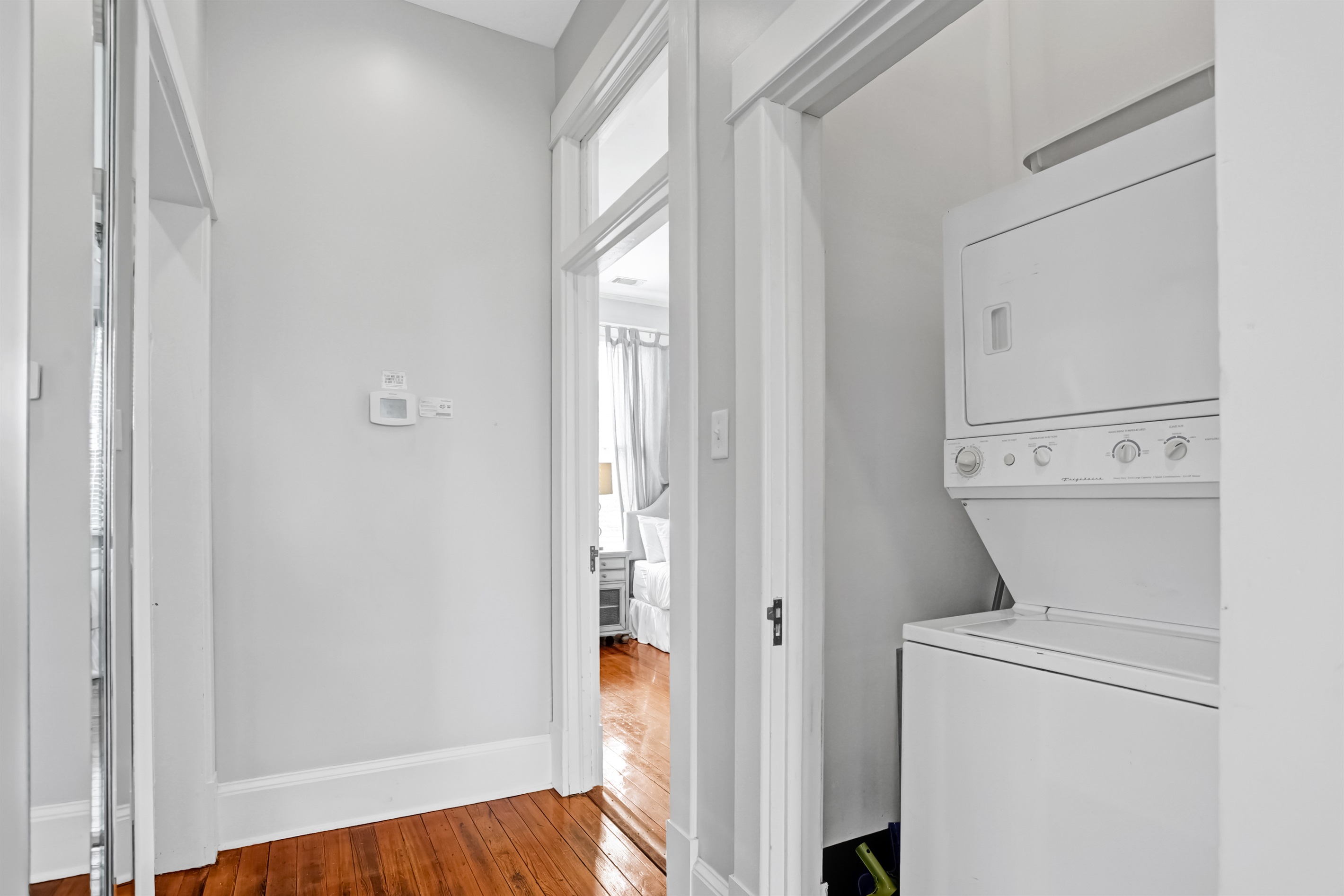 A tucked-away laundry closet in the hallway adds convenience for longer stays.