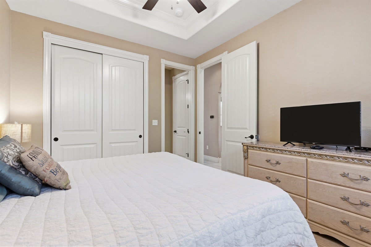 Beautifully styled bedroom with comfortable bed and warm ambiance.