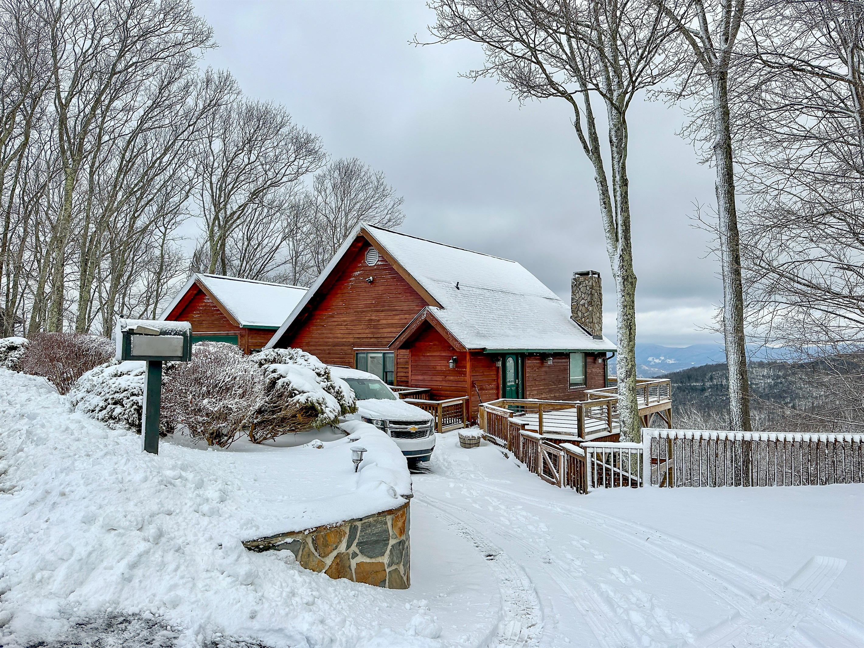 Level entry access via a circular driveway with plenty of parking. Main roads do get plowed by 10am on mornings of fresh snow.