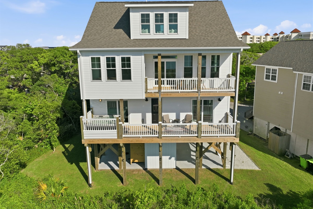 Multi-level decks and outdoor seating make it easy to soak in the coastal breeze