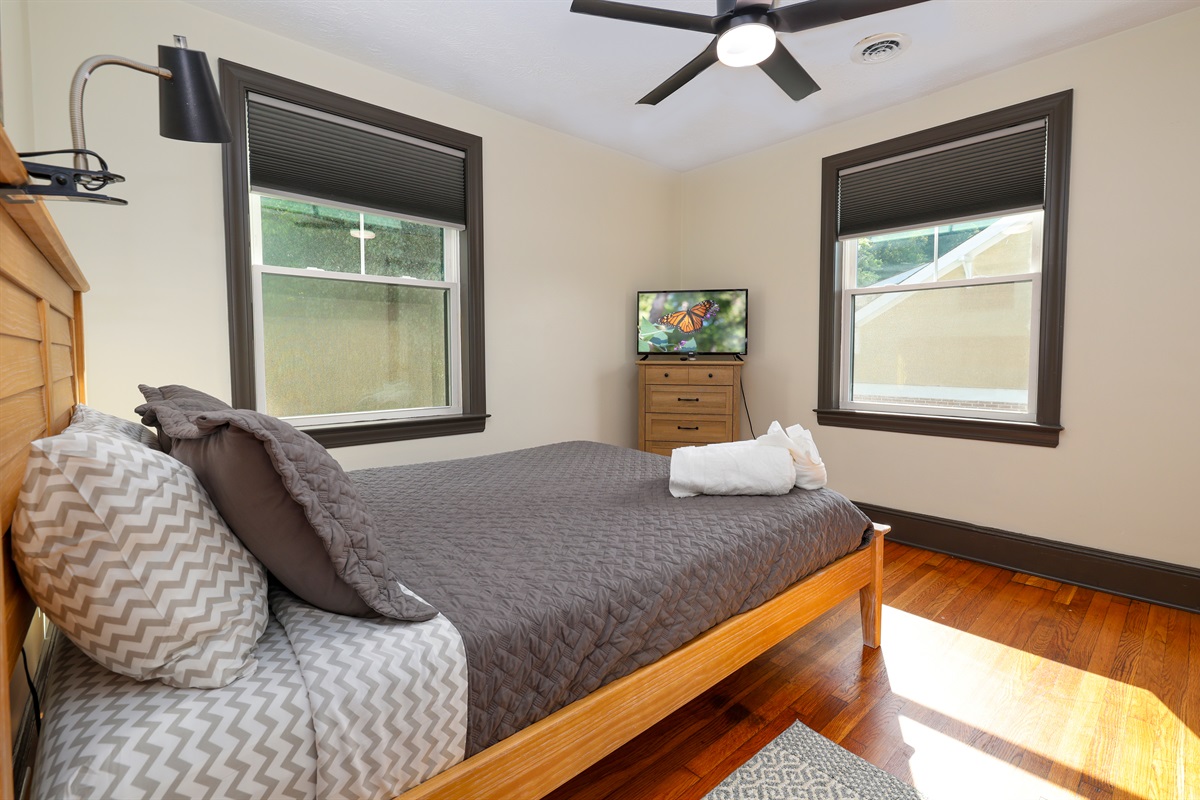 Bedroom with queen bed and Roku TV
