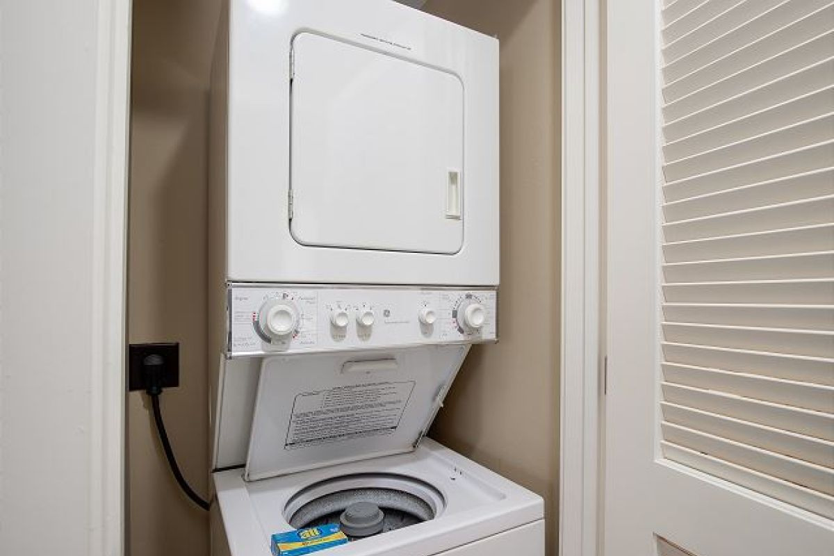 Stackable washer and dryer in the hallway closet for laundry during your stay