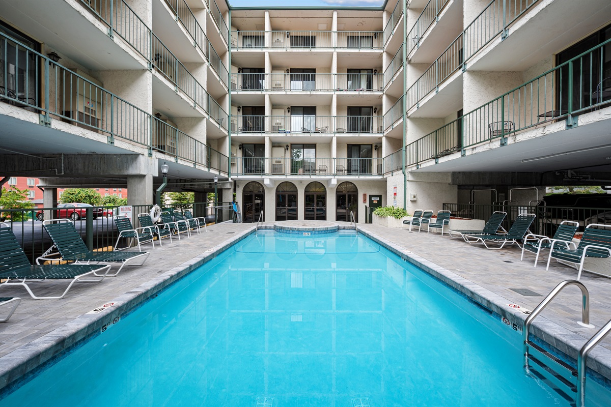 Sparkling outdoor pool just steps from your condo