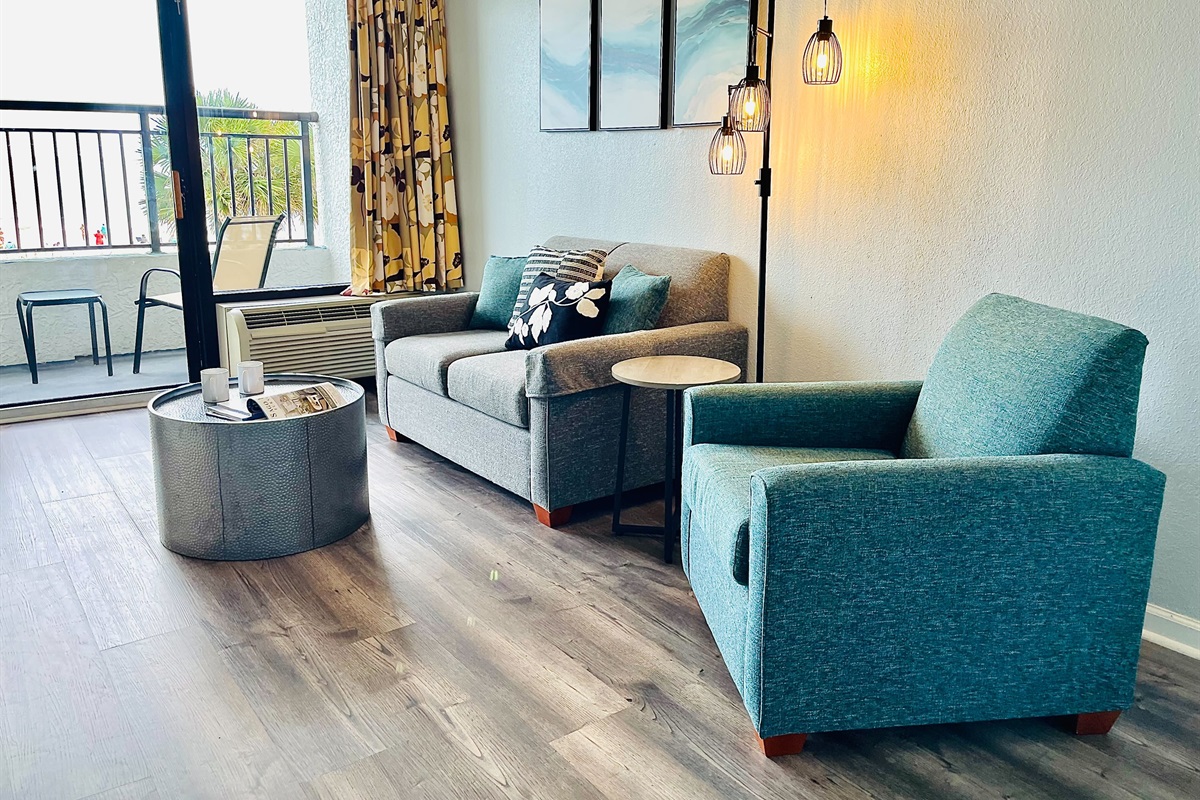 Allow the gentle sea breeze and soothing sound of waves to create a calming soundtrack for your time spent in the living room, enhancing the overall coastal experience.