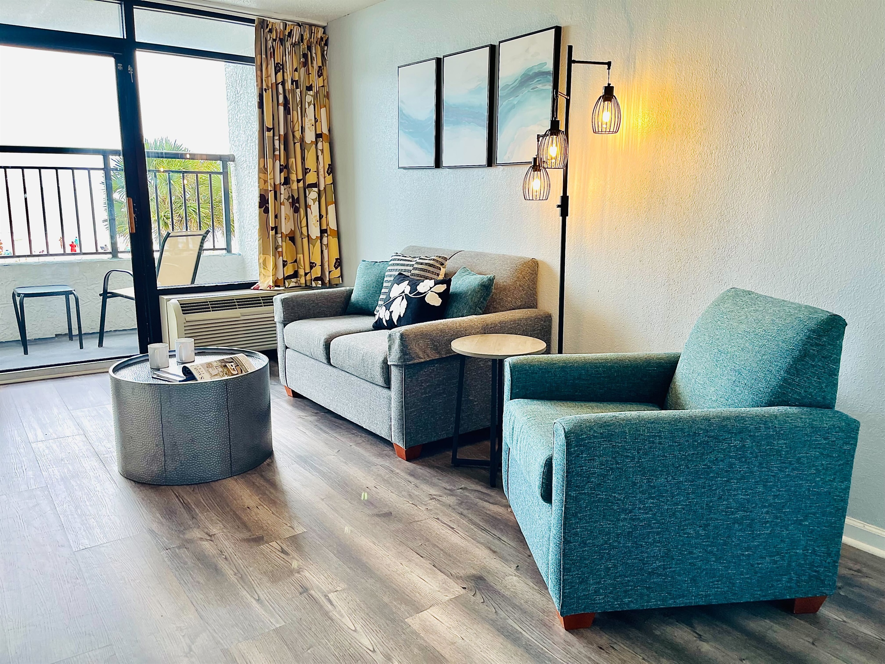 Allow the gentle sea breeze and soothing sound of waves to create a calming soundtrack for your time spent in the living room, enhancing the overall coastal experience.