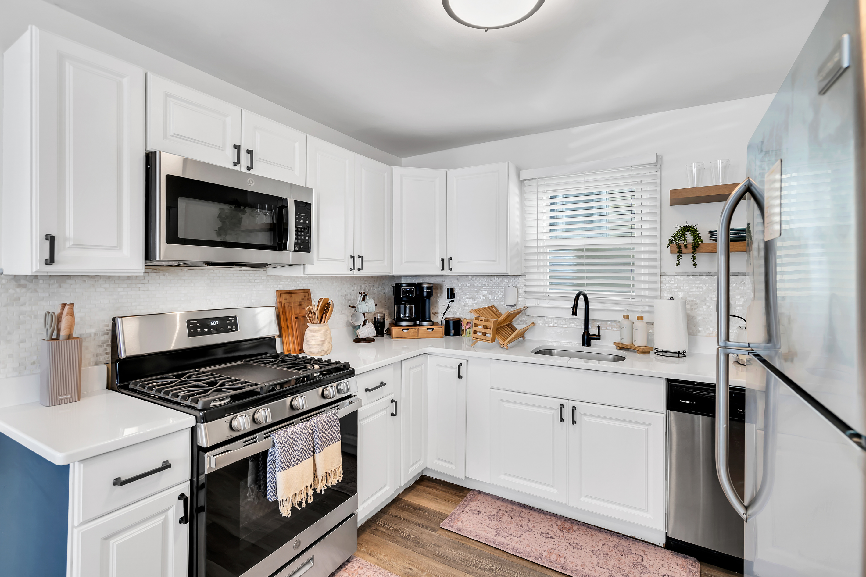 Cook breakfast before the beach or a full dinner after. You have a gas range, stainless appliances, and granite counters with real room to work.