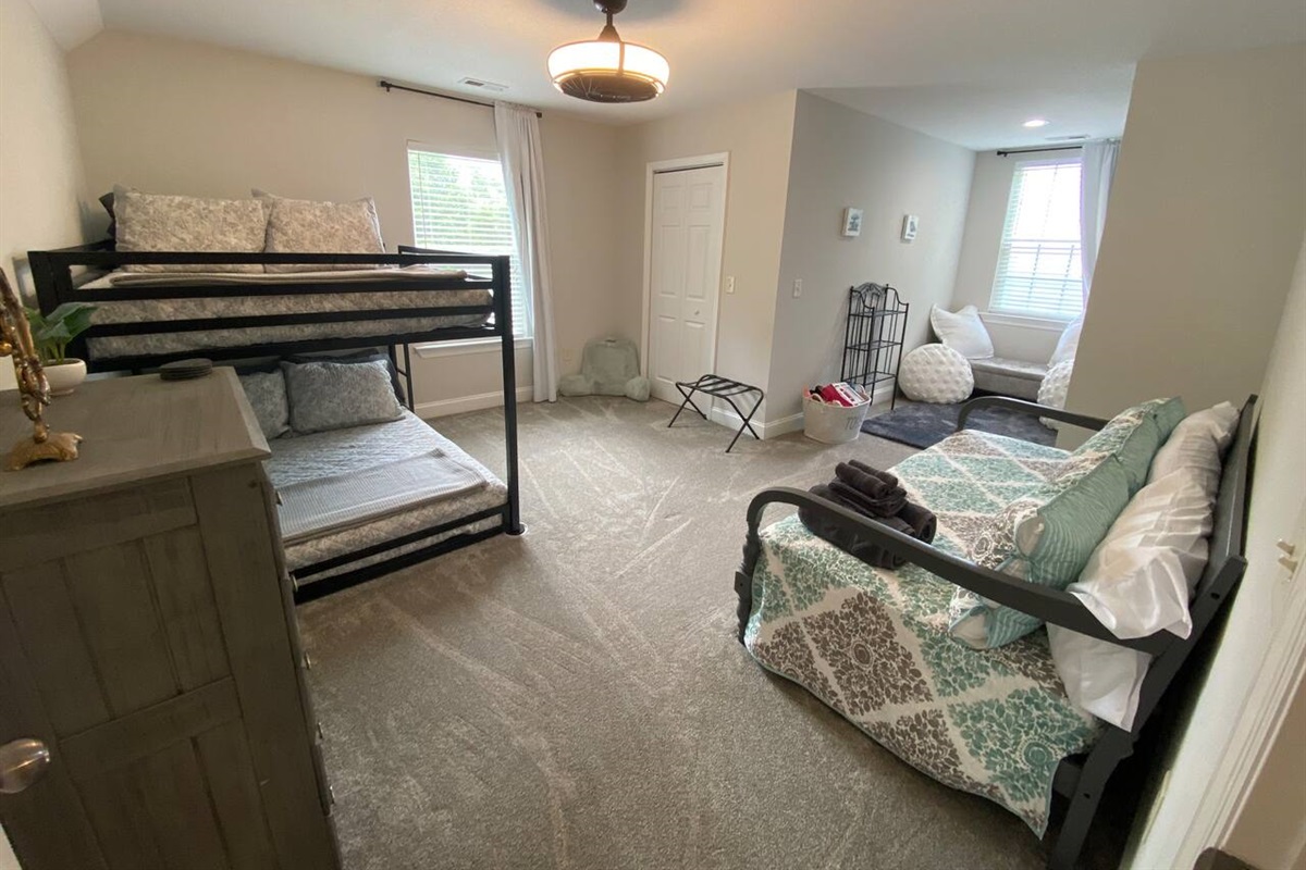 Upstairs bedroom with 2 fullsize bunk beds and a twin size day bed. This room also has a play/reading nook. Bunk beds are both memory foam mattresses and have memory foam and hypo-allergenic goose down alternative pillows. 