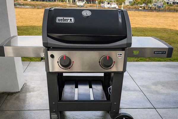 Weber gas grill ready for backyard BBQ season and outdoor cooking.