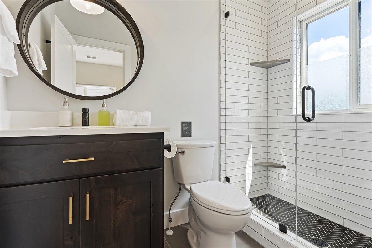 Refresh in a stylish bathroom featuring a modern walk-in shower and refined, contemporary finishes.