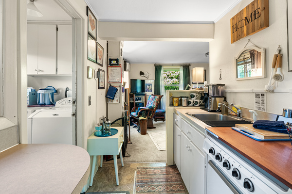 The kitchen — full service for eight and a coffee bar most cafés would envy.