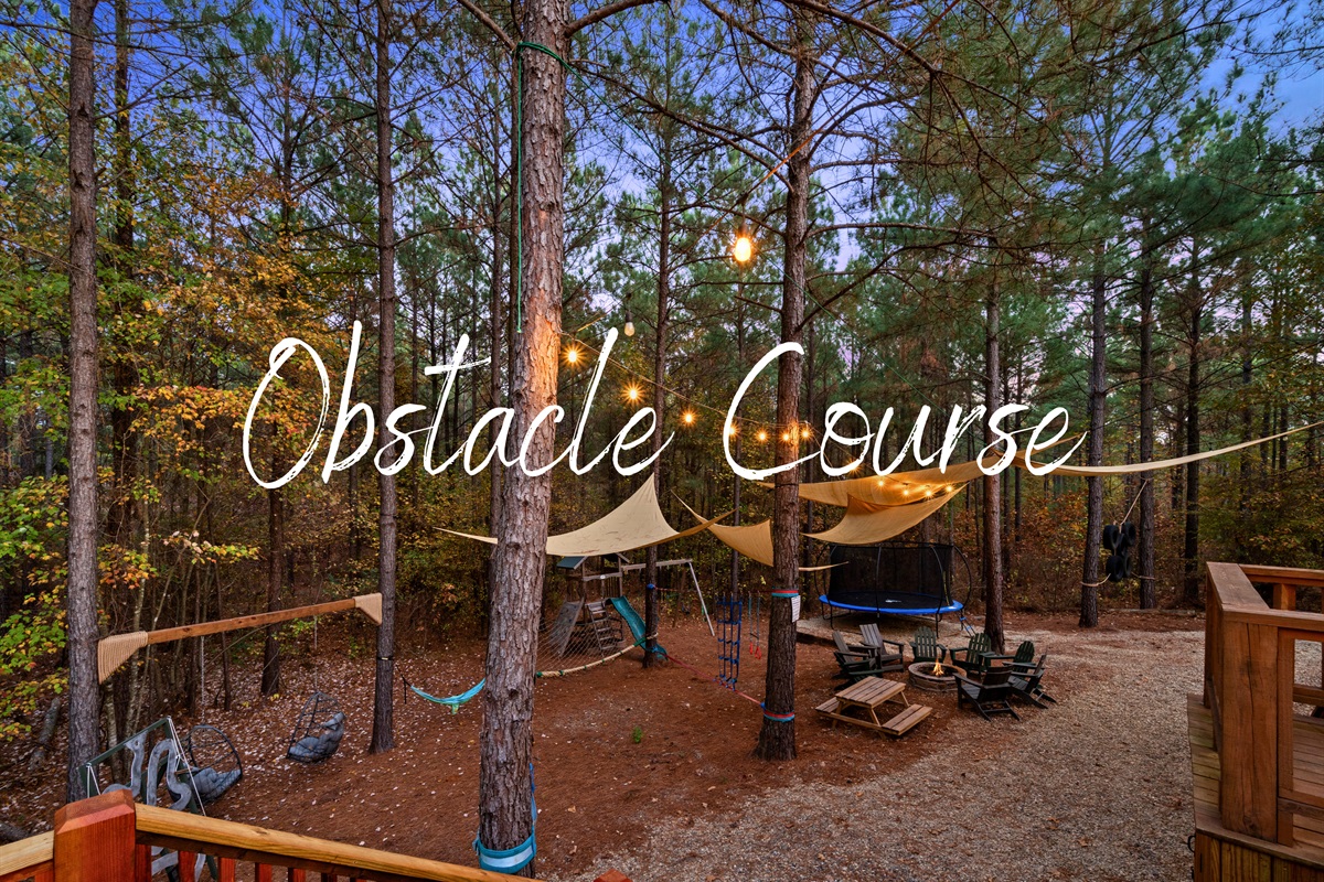 Here’s a look at the obstacle course, a fun little spot where everyone can climb, balance, and test their skills right in the middle of the trees.