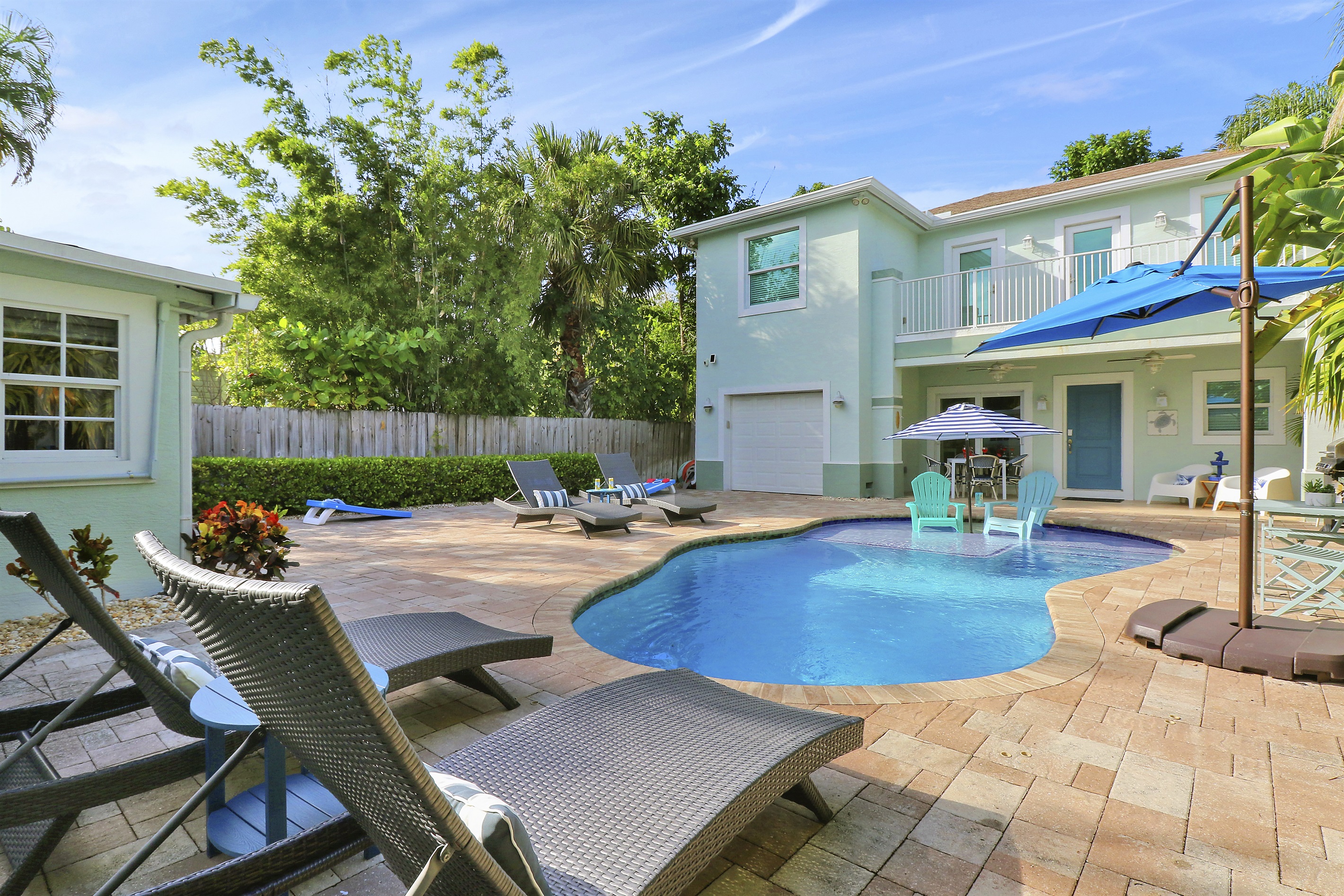 Expansive, tropical courtyard pool area with options for lots of sun or shade