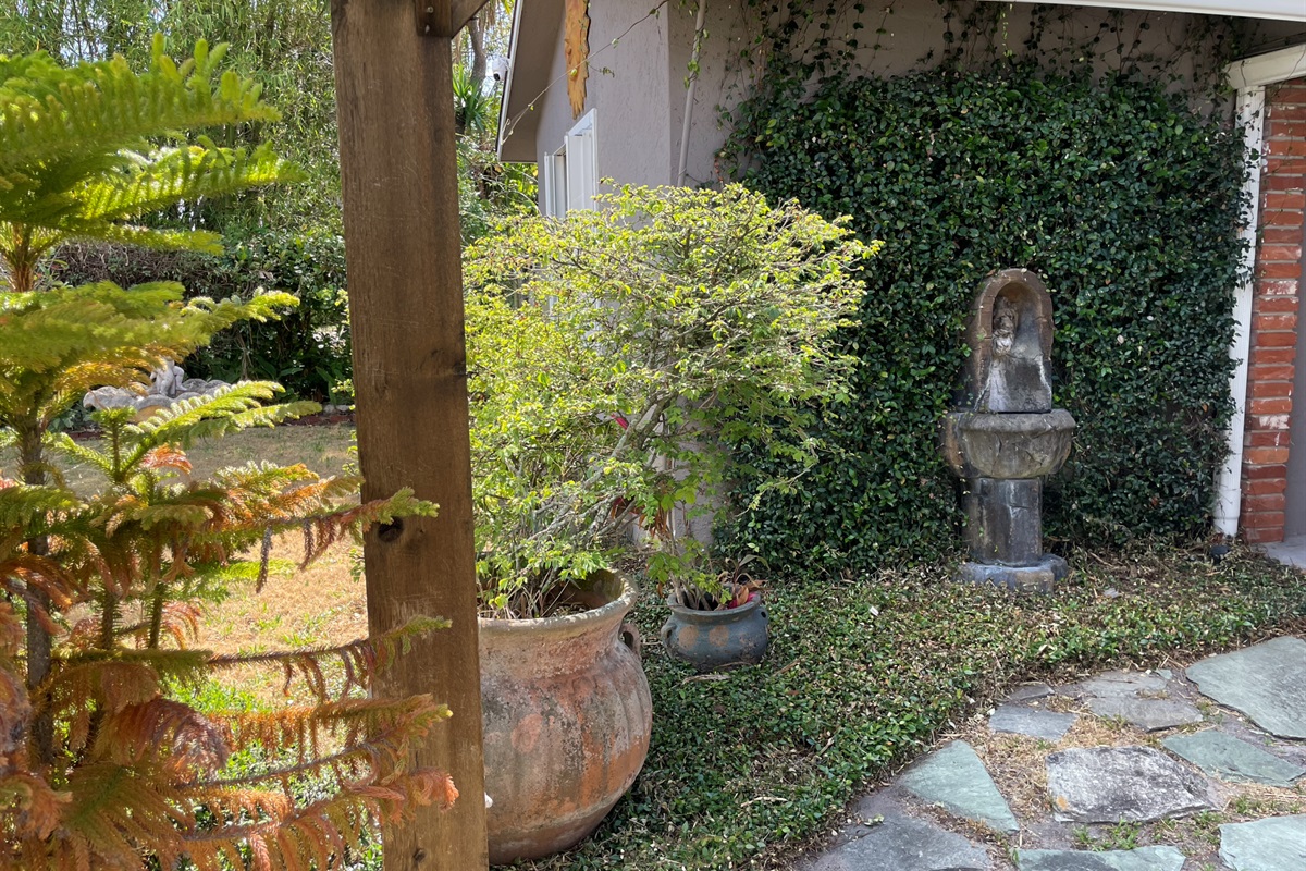 Enjoy time outside under the pergola, surrounded by a garden and fountains.