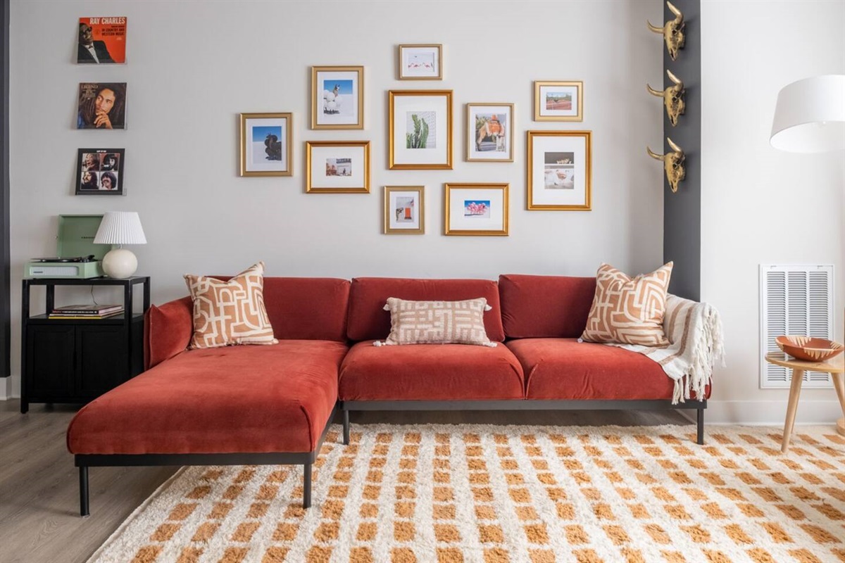 With plenty of seating for 6 in the modern and colorful, open living room for group hangouts. 65 inch smart TV. Play a record or two on the record player while you enjoy your stay!