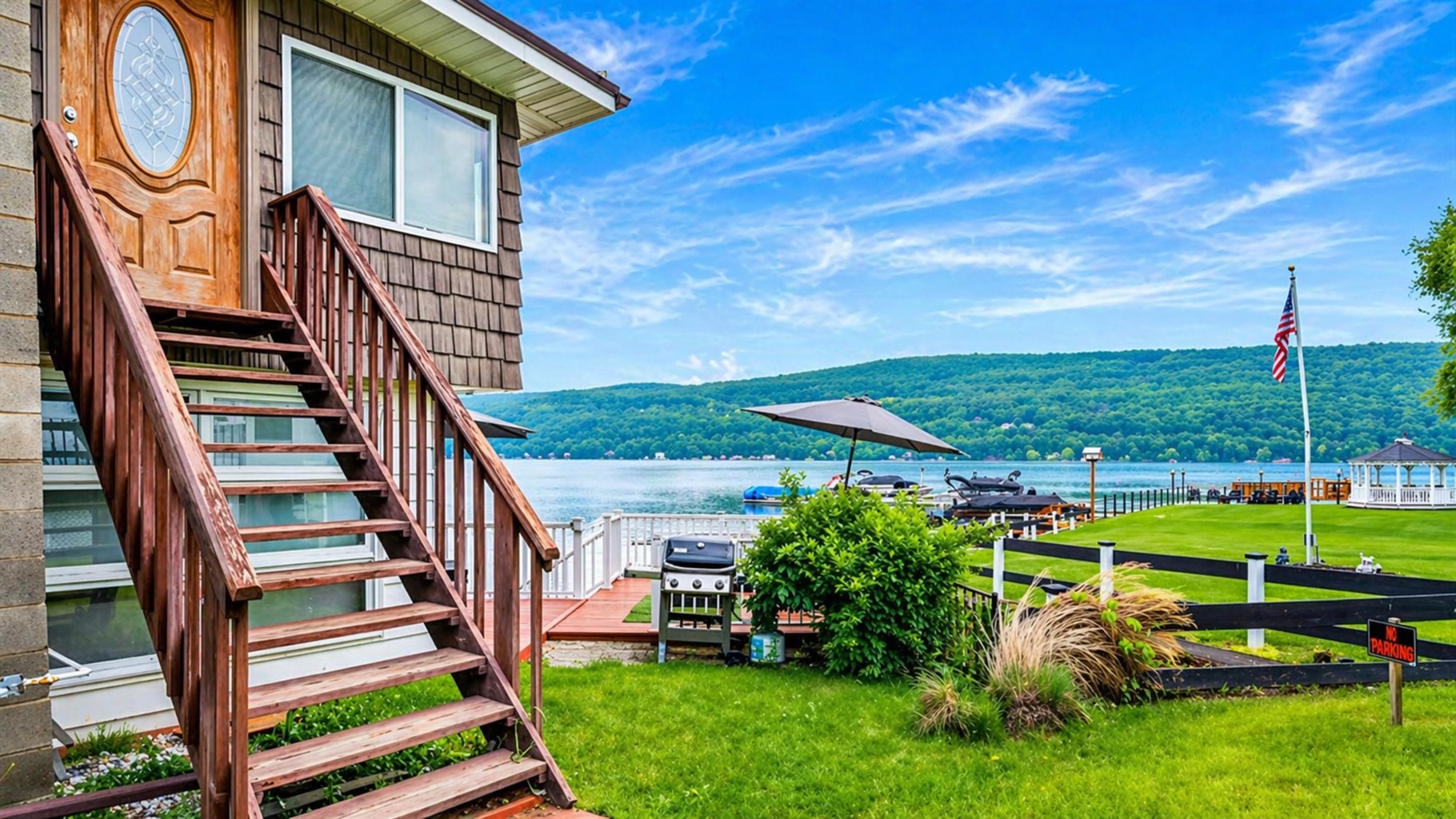 Lakeside retreat with stunning views, a cozy entry, and outdoor grill for relaxed dining.