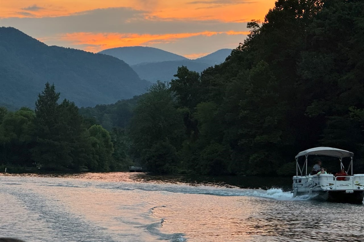 Boating on beautiful Lake Lure, minutes away. Pontoon boats available for rent.