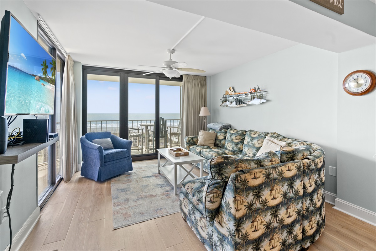 Spacious Living Room with oceanfront views and balcony