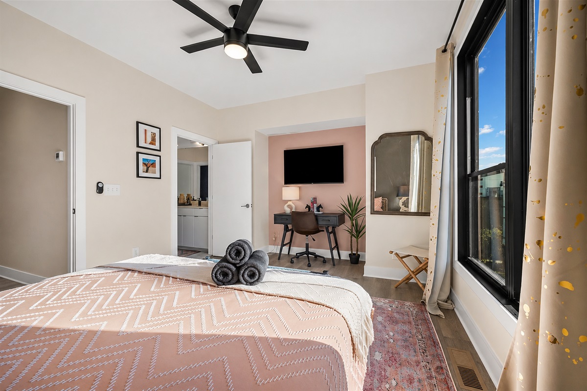 Bright, spacious king bedroom with a dedicated workspace and easy ensuite access&mdash;perfect for unwinding or getting a little work done between adventures.