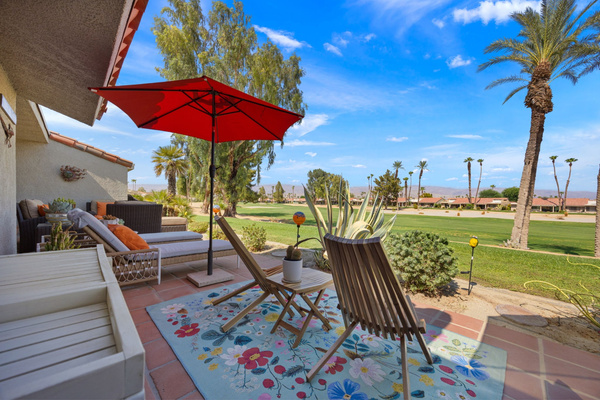 Spacious back patio with ample seating