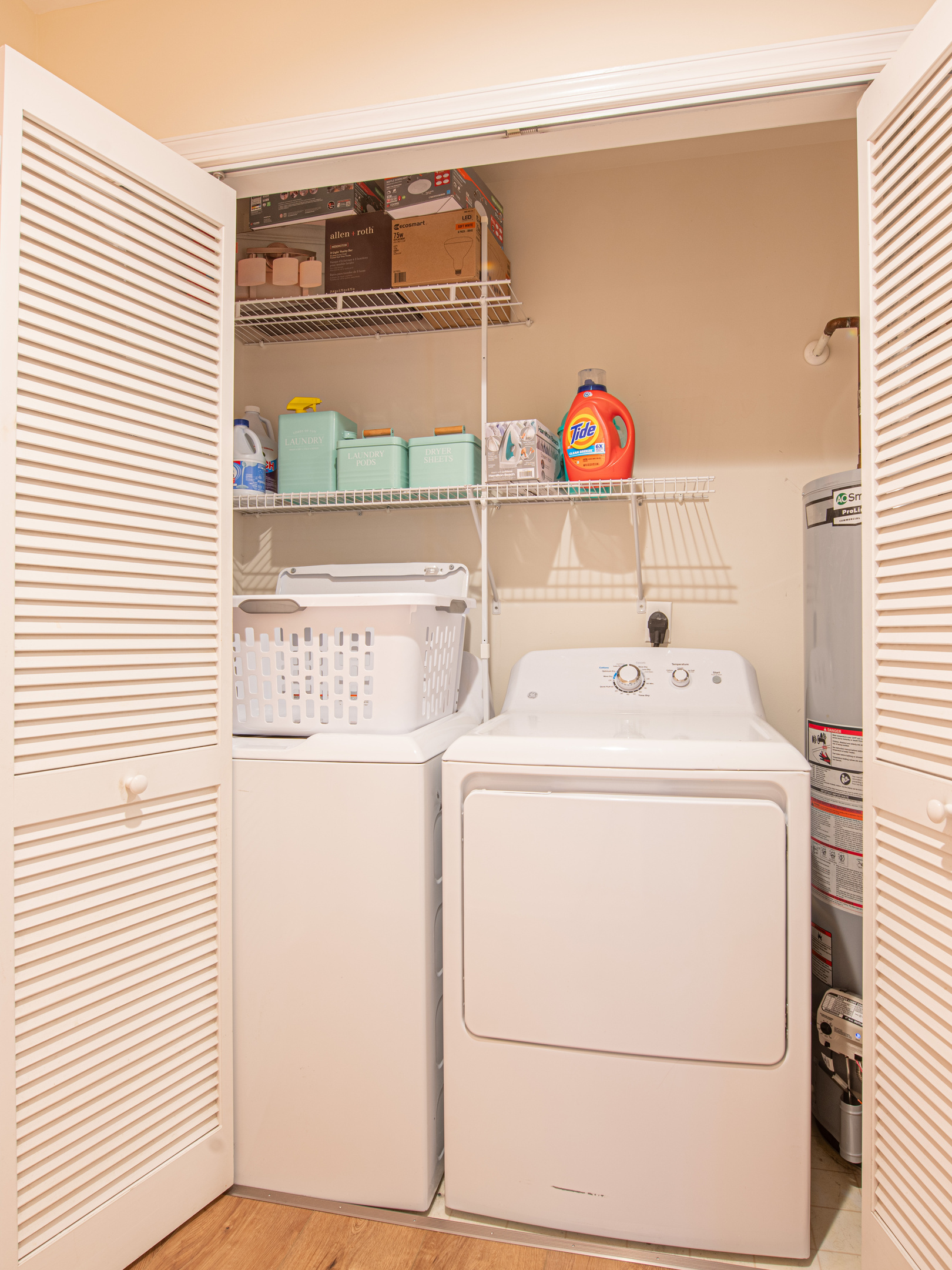 Laundry Closet with Washer, Dryer, and Storage Shelving