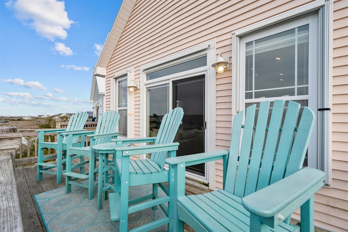 This is a space made for making memories- private top floor balcony with high-top Adirondack chairs overlooking the sound