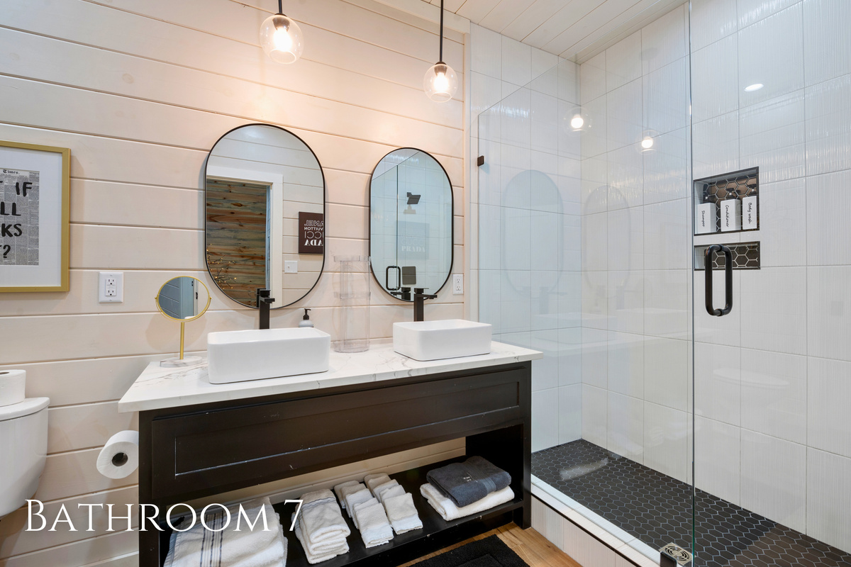 Double vessel sinks and a spacious walk in shower give everyone plenty of room to get ready while adding a clean, modern touch to the bunkhouse.