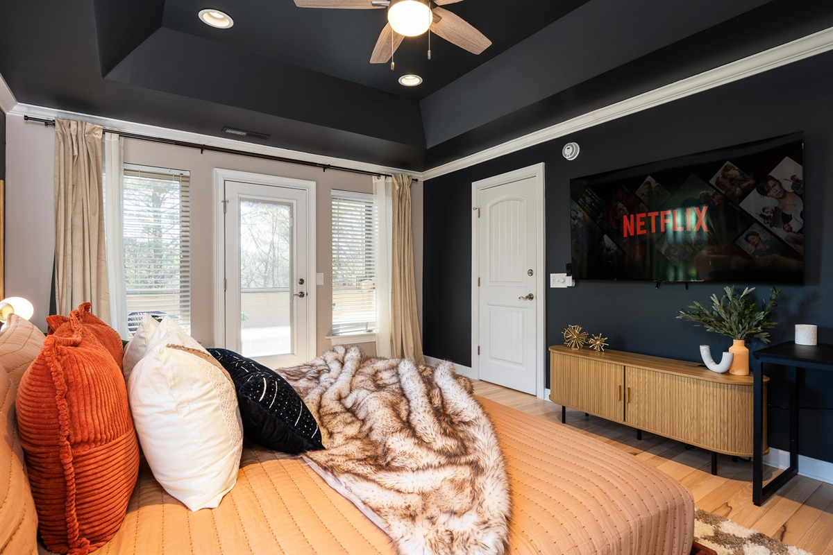 Bedroom with dual seating and workspace - ideal for both relaxation and light productivity
