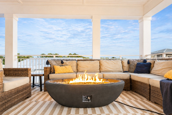 3rd floor rooftop patio that's 500sq ft, and has a rooftop fire pit, dining for 16, outdoor TV, grill, and beverage fridge