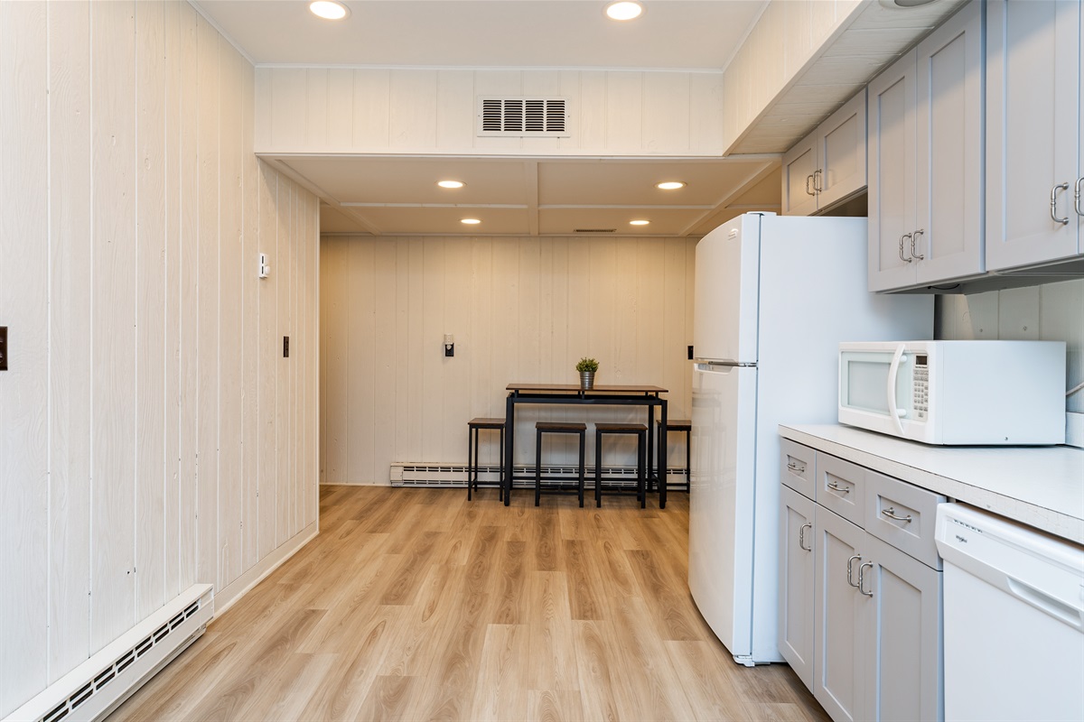 Whip up meals with ease in the spacious, full basement kitchen featuring modern appliances and plenty of counter space.