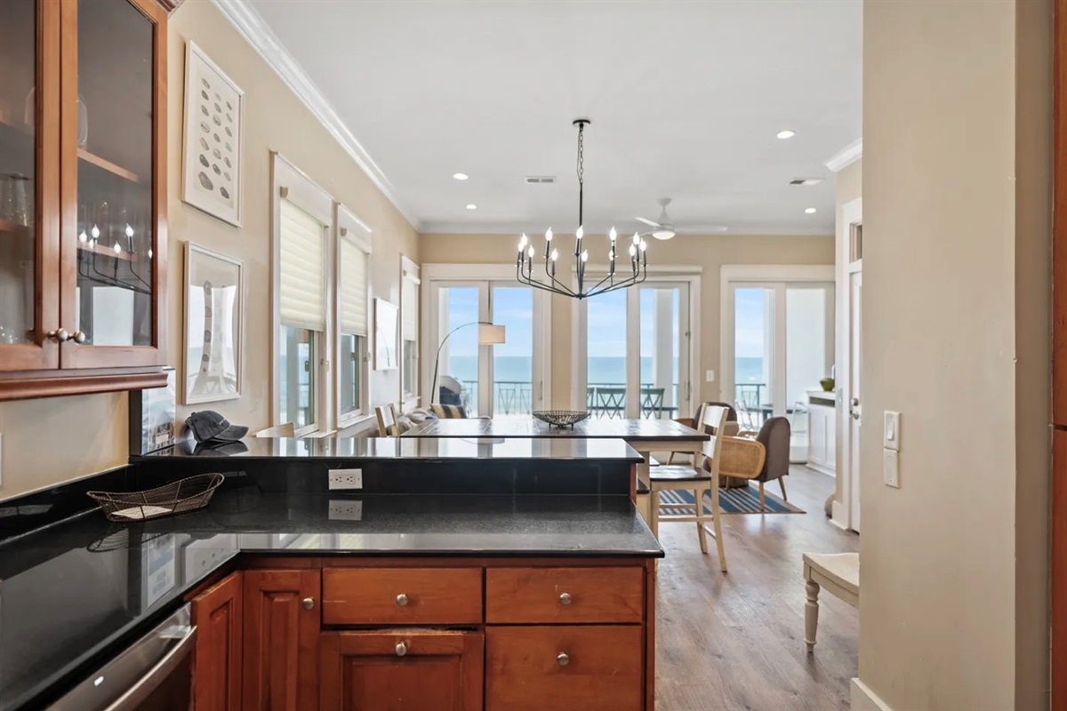 Remodeled Kitchen with granite countertops, stainless appliances - cook delicious meals and dine while overlooking the Gulf of Mexico!