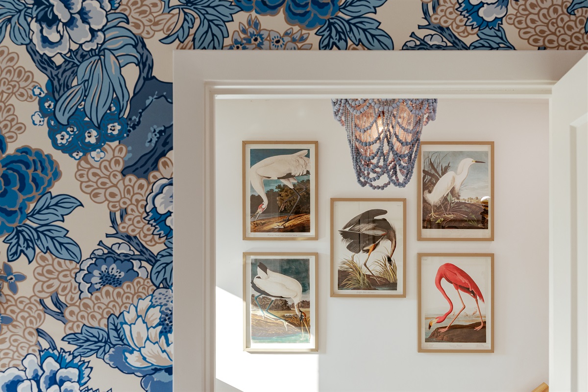 As you head upstairs, drawings of fowl local to the area bring the outdoors inside.