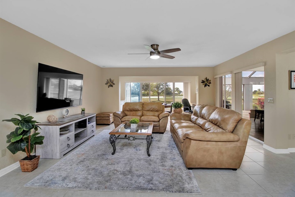 Spacious Living room with a 75" Tv.