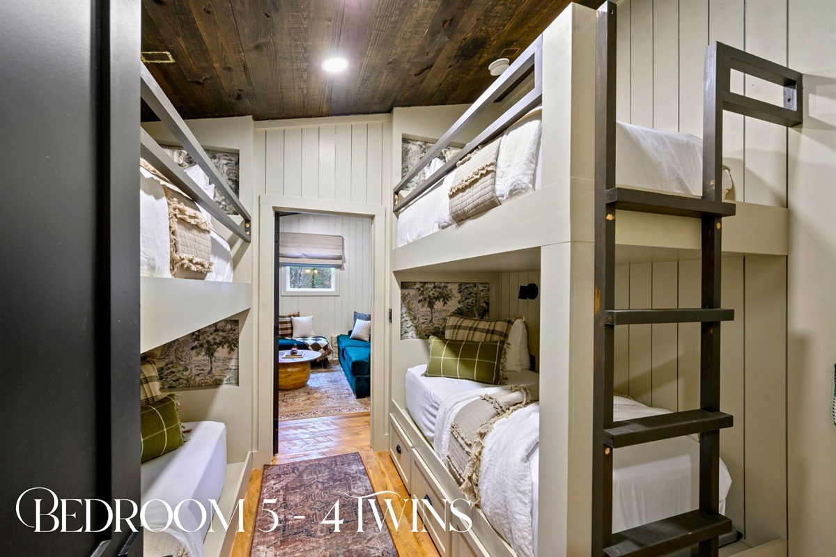 The bunk room offers four twin beds, making it a fun and comfortable hangout for kids or extra guests.