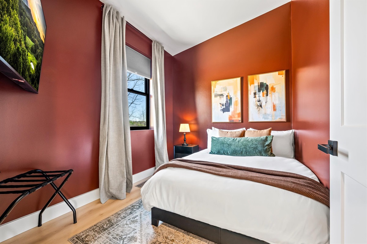 {Full Bedroom}
Warm tones, clean lines, and thoughtful details — a full bedroom with 55 in Roku TV and built-in luggage storage that makes settling in effortless.