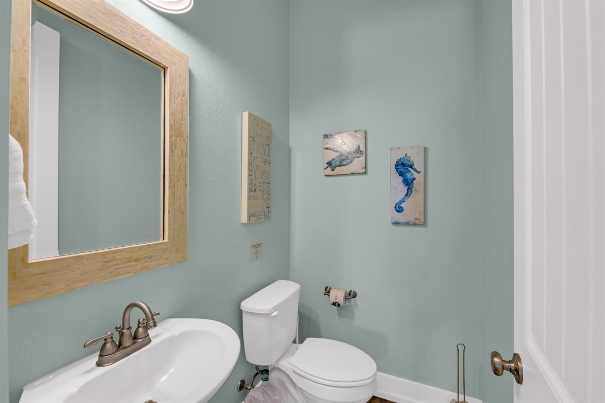 Sea It All: Half bathroom, single vanity, off the living room area on main floor.