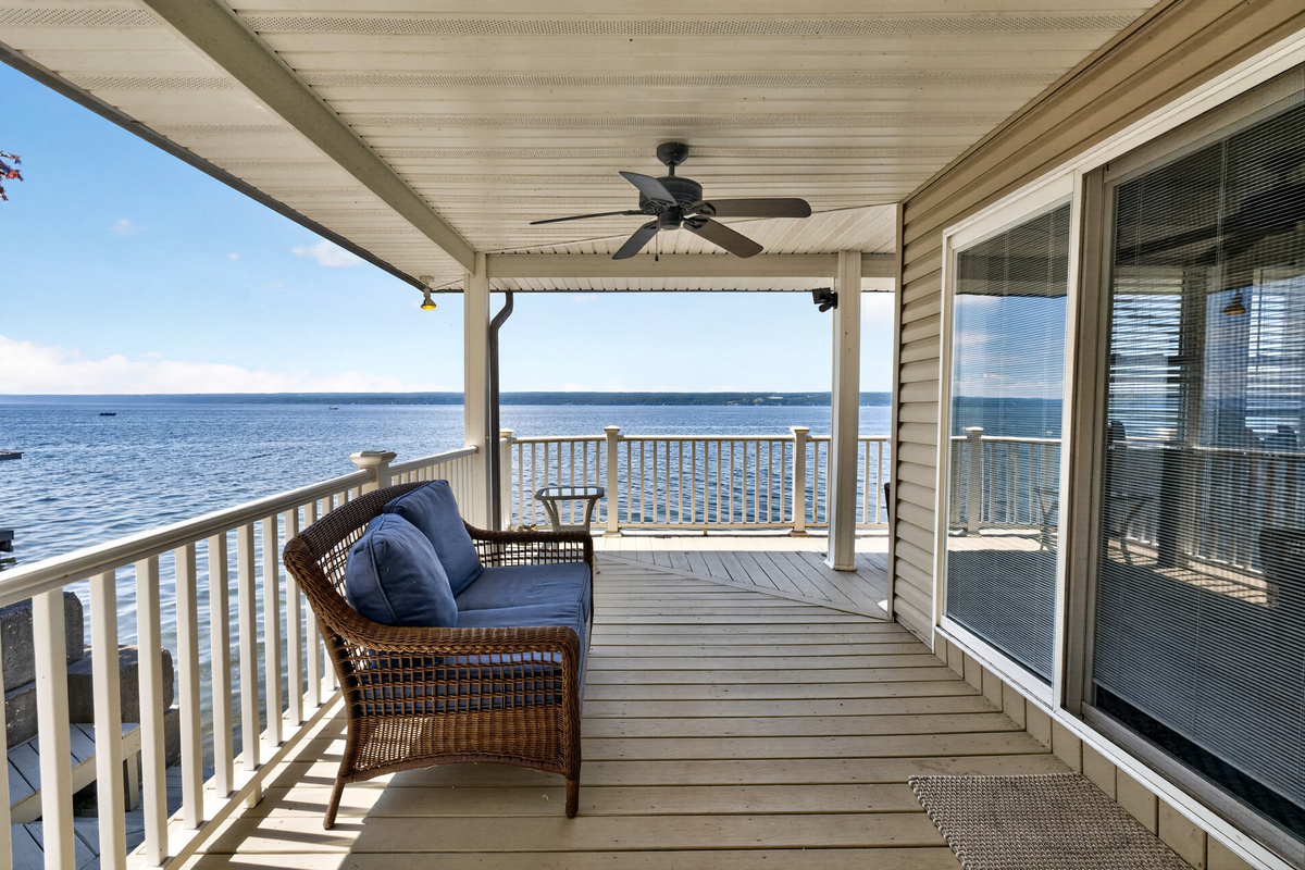 Covered deck with grill and lake view
