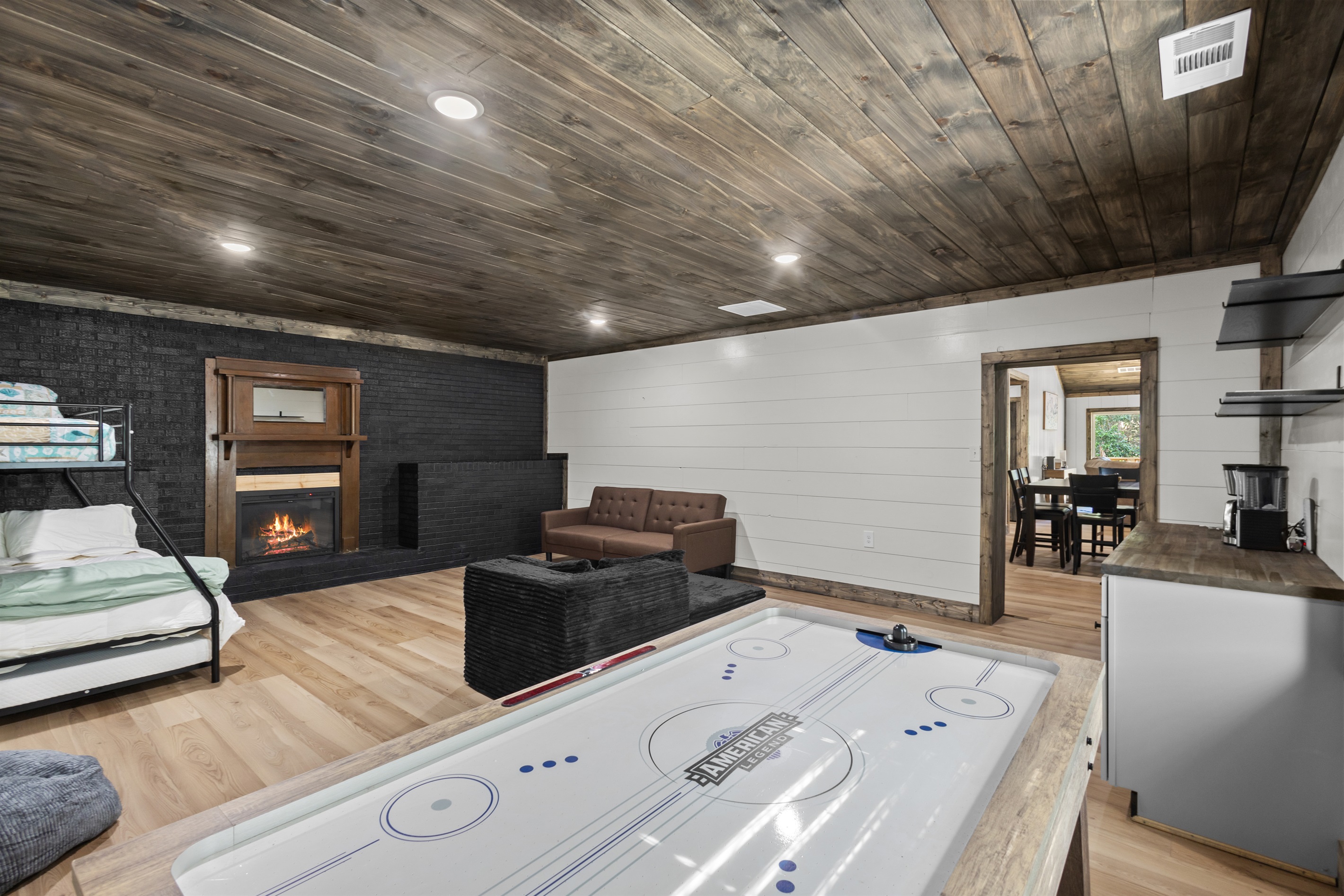 Game Room with Air Hockey table and additional sleeping area. 