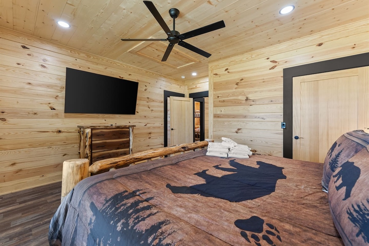 Kick back and relax with a large flat-screen TV, ceiling fan, and beautiful wood accents throughout—ideal for unwinding after a day outdoors.

