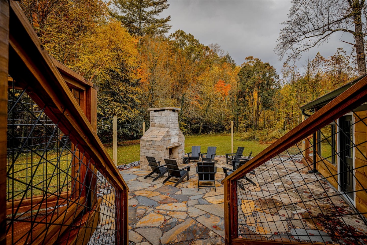 The sweeping backyard and striking outdoor chimney create an elegant gathering space where evenings are best spent relaxing with family and friends.