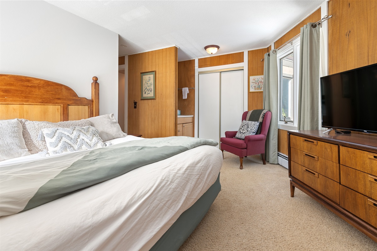 Master with King bed and vanity sink in background